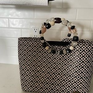 Small fashionable purse used 3 times only bought at Steinmart 6 years ago.